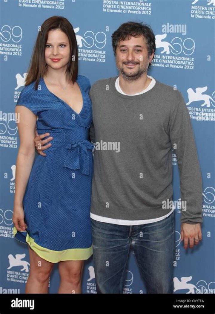 Both Rachel Korine and Harmony Korine are posing in front of washroom mirror as Rachel is taking a selfie.