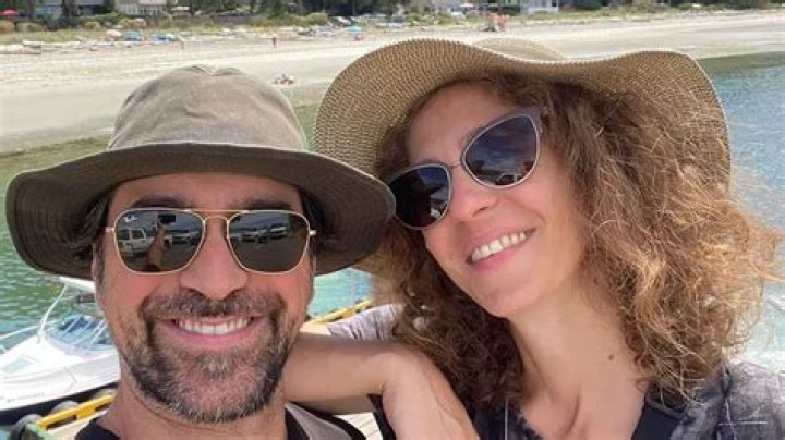 Carmel Amit with her husband David Attar. celebsfortune.com