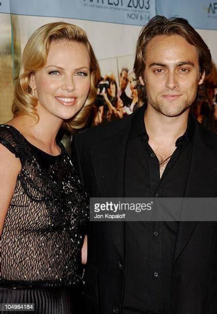 Charlize Theron and Stuart Townsend on a boat