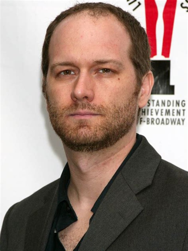 Erik Jensen poses at a photo call for the new Manhattan Theatre Club play "The Collaboration" at The Manhattan Theatre Club Rehearsal Studios on No...