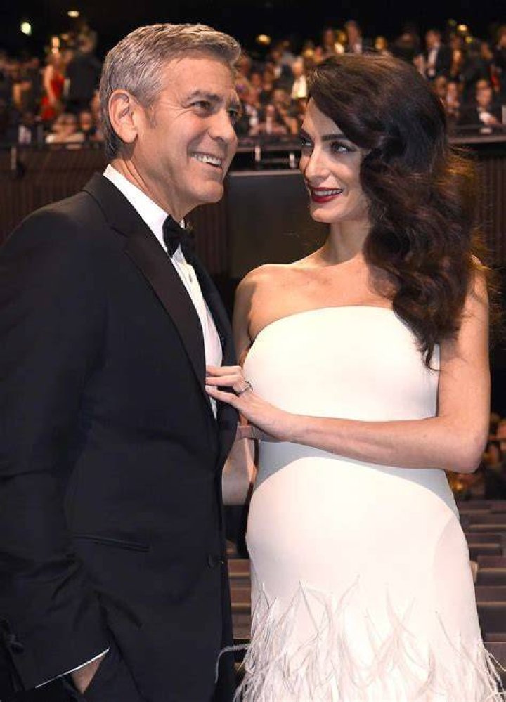 George Clooney and his pregnant wife Amal Clooney leave L'hotel
