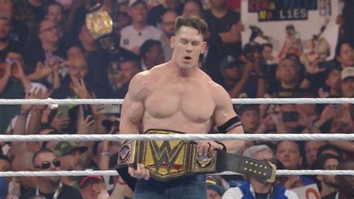 John Cena lifting WWE championship